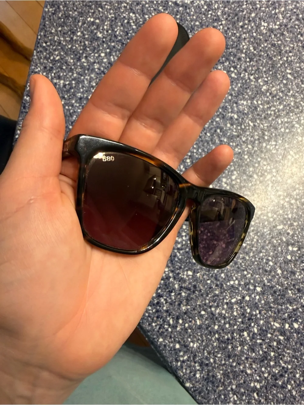 Costa Women’s Black Sunglasses with Purple-Tinted Lenses